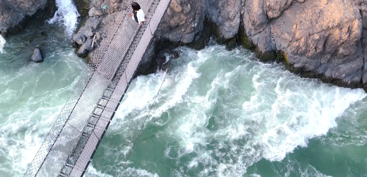 Li Phi suspension bridge over Mekong rapids